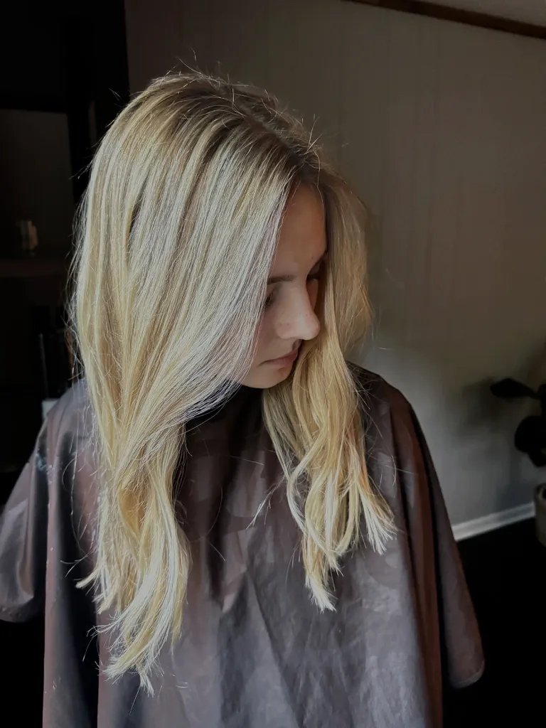 Beautiful blonde balayage with soft waves — styled by Debrah